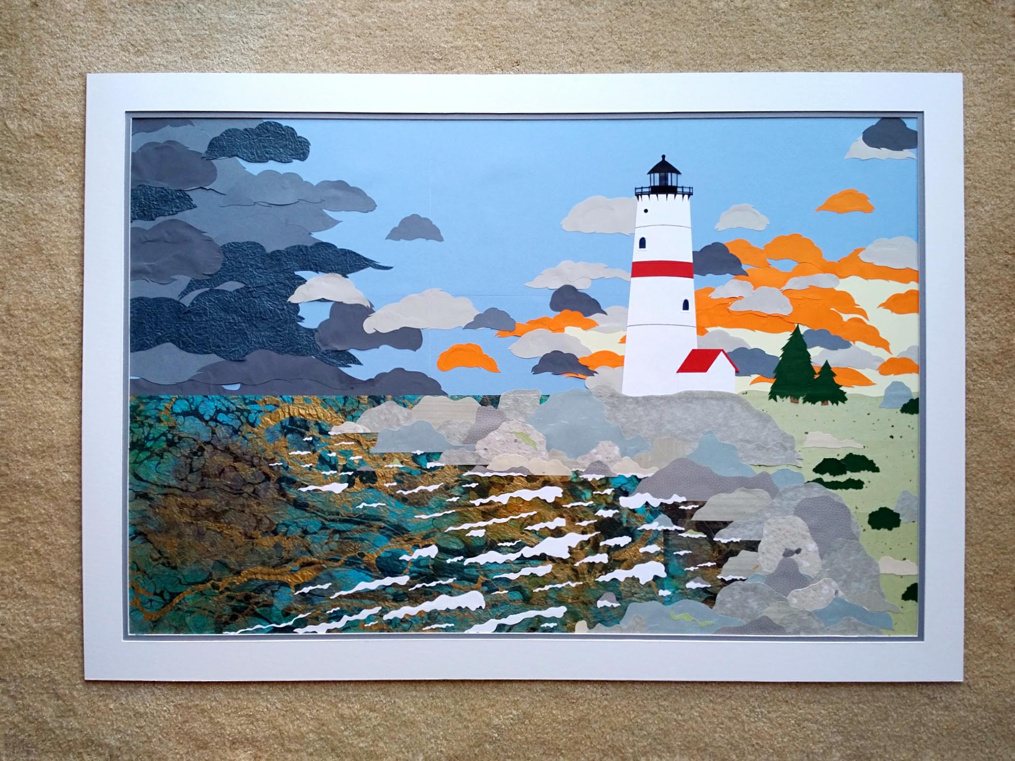 Image of a white lighthouse with a red stripe on top of a rocky outcropping. There are storm clouds and orange clouds from a sunset. The ocean has a marbled surface and whitecaps. The entire piece is made from various texture and color papers. 